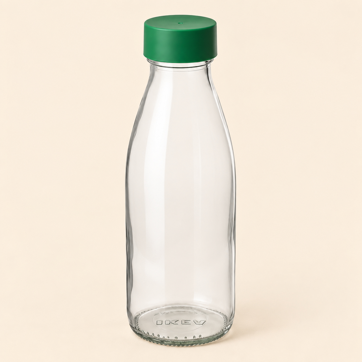 Front view of the empty VERA clear glass bottle with a green screw cap against a plain beige background.