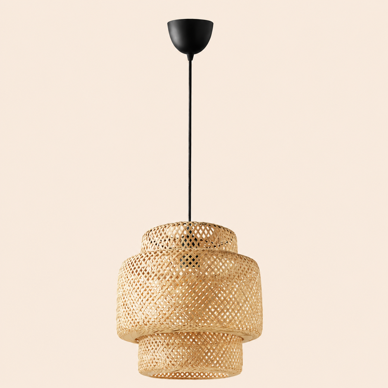 Riva Woven Rattan Pendant Lamp featuring a layered cylindrical design, natural rattan weave, and black hanging cord.