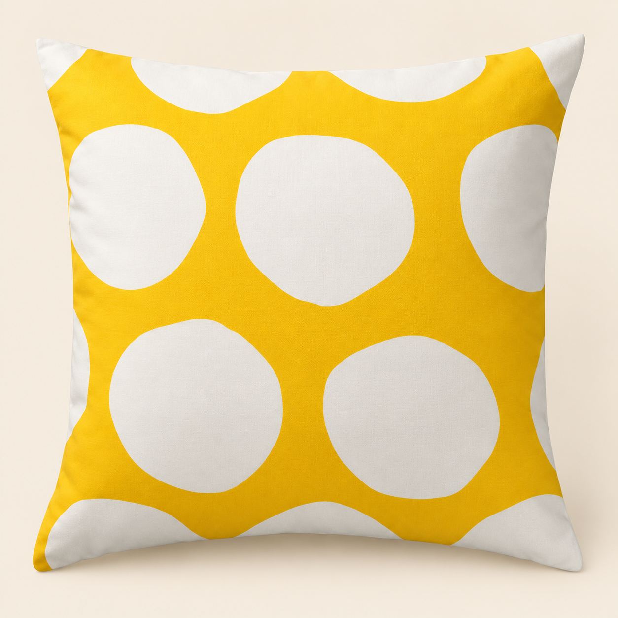 yellow and white geometric patterned cushion placed on a beige sofa in a modern living room.